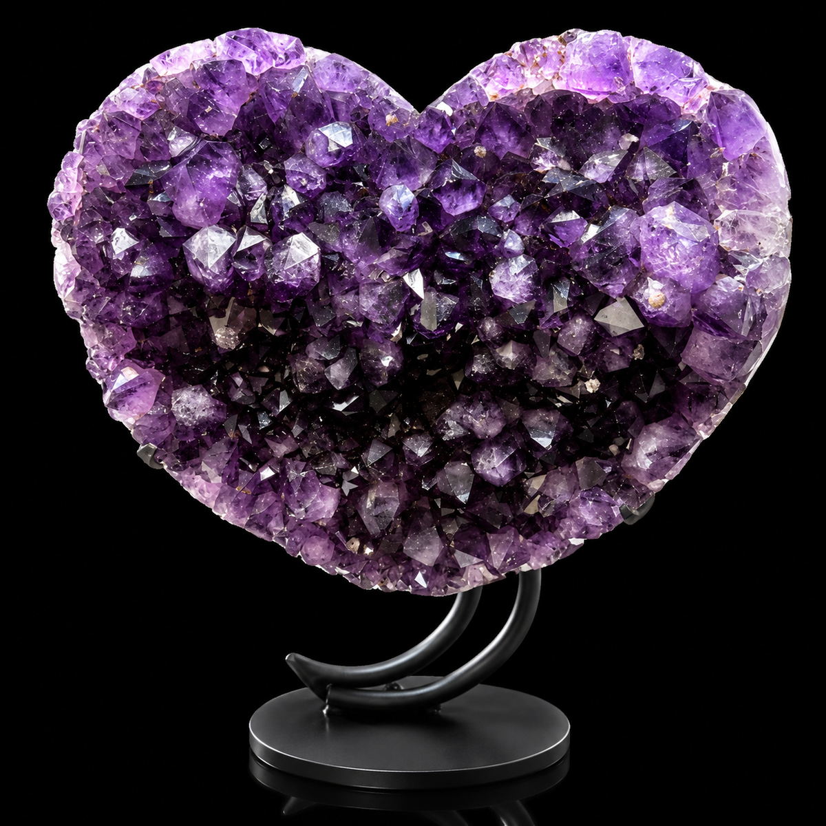 Brazilian amethyst heart with red hematite on black stand