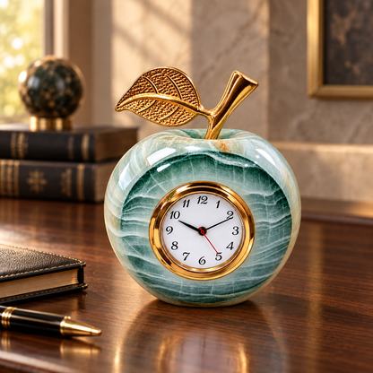 Green onyx apple clock displayed on an elegant office desk
